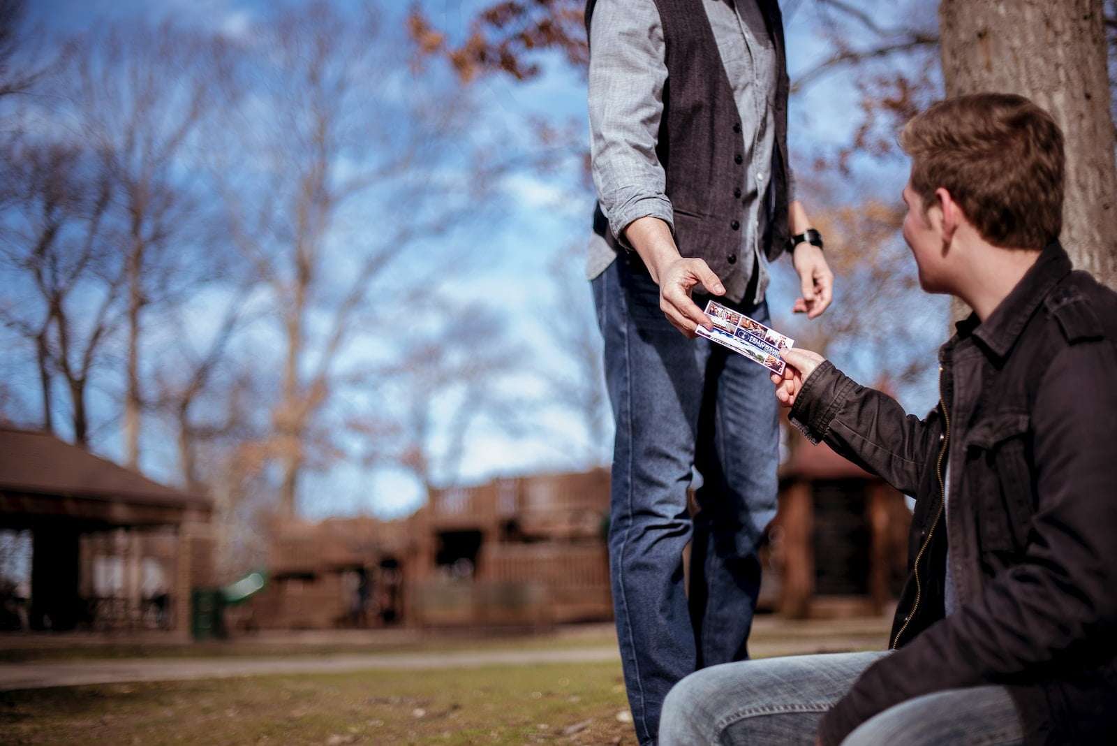 person giving something to man - surrendering to Jesus