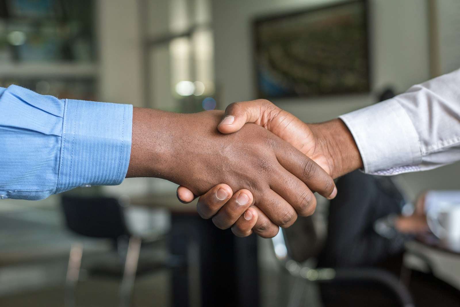 two people shaking hands - the power of sharing God's word